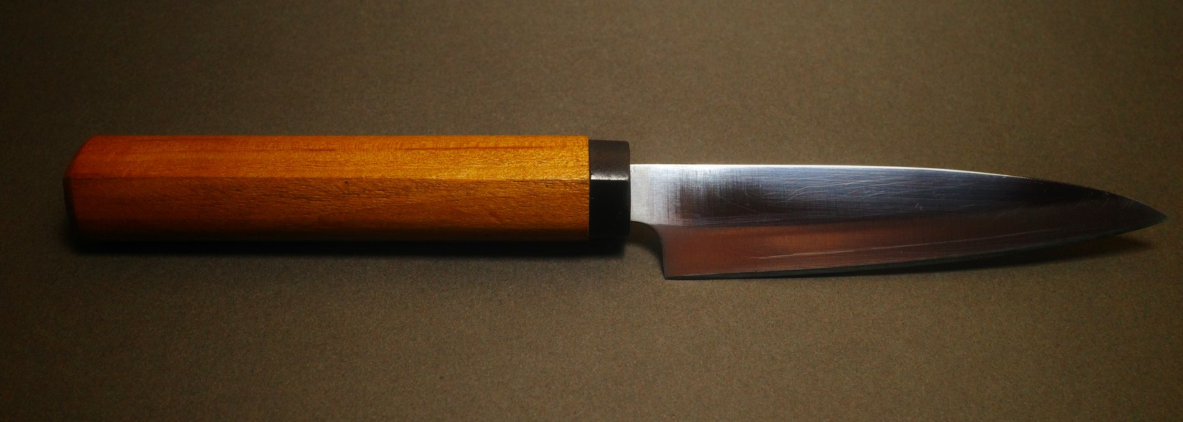 The same petty knife after sharpening, rust removed and a clean edge restored