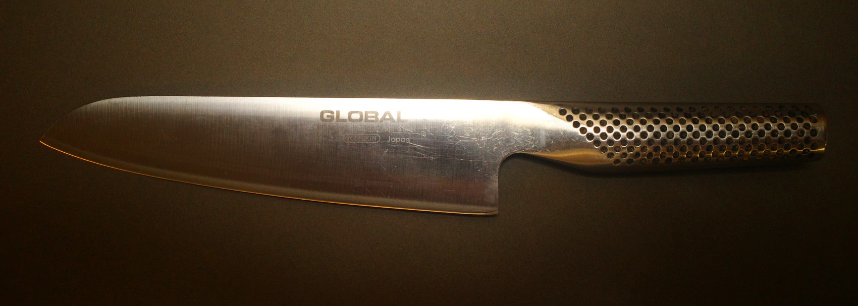The same Global chef knife after sharpening and polishing