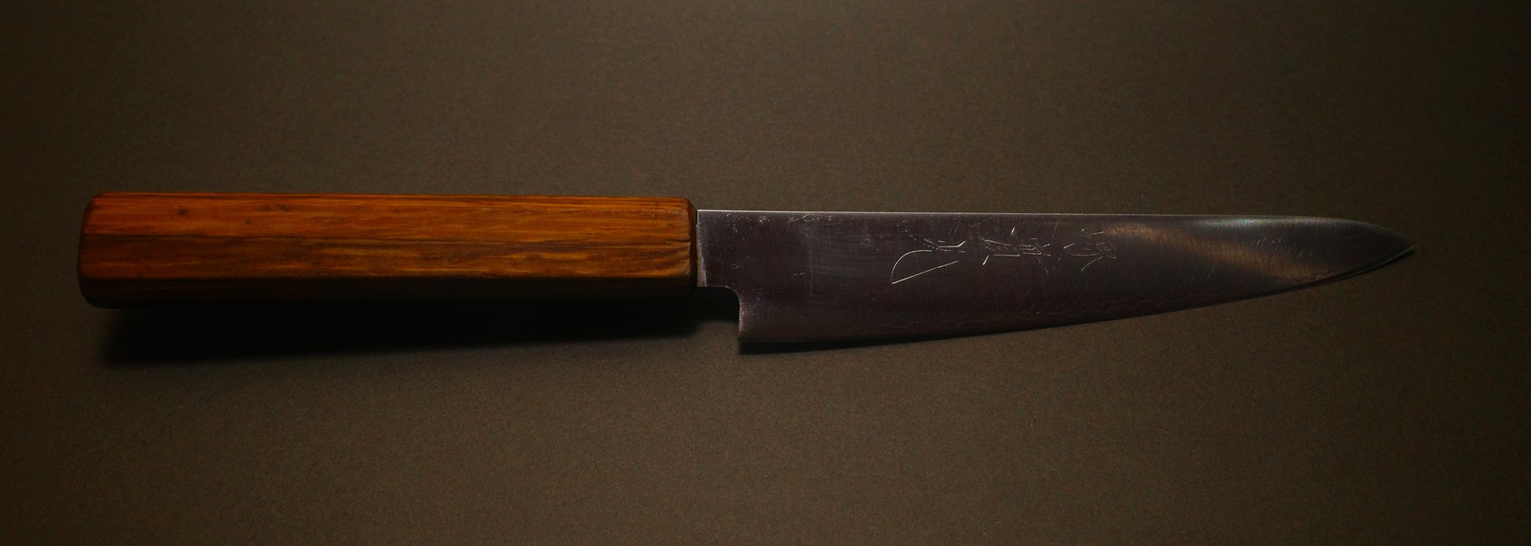 The same petty knife after sharpening, brightened with a clean edge