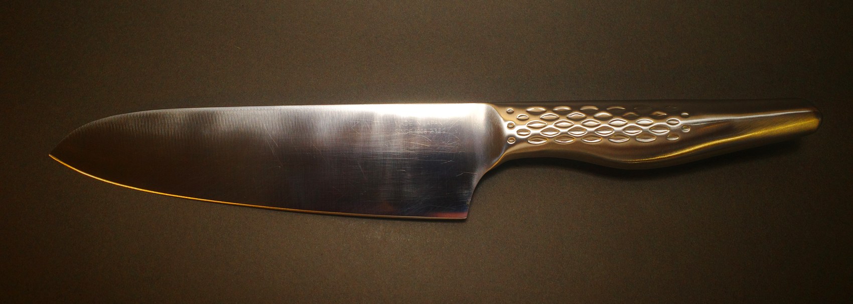 The same KAI chef knife after the tip was reshaped and the blade sharpened